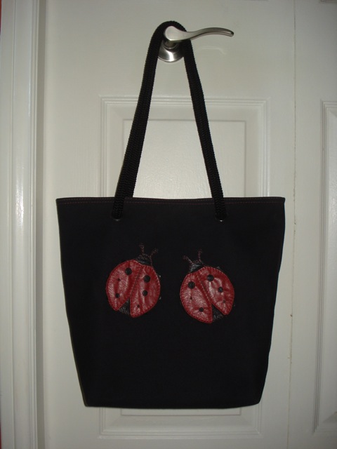 black tote with ladybugs